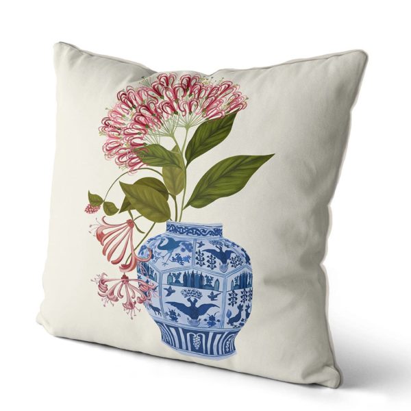 Pillow with Chinchona Vase w red flower design, side view.
